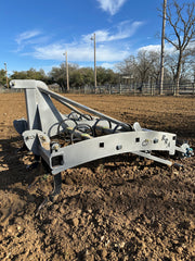 Side view of Buster 1.0 arena drag working arena footing