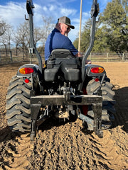 Rear view of tractor 3-point hitch hookup used with Red River Arenas Buster arena drag and arena groomer attachment