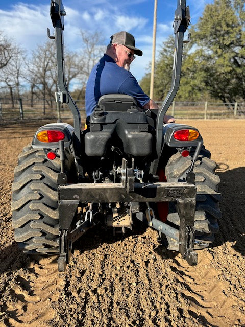 Rear view of tractor 3-point hitch hookup used with Red River Arenas Buster arena drag and arena groomer attachment