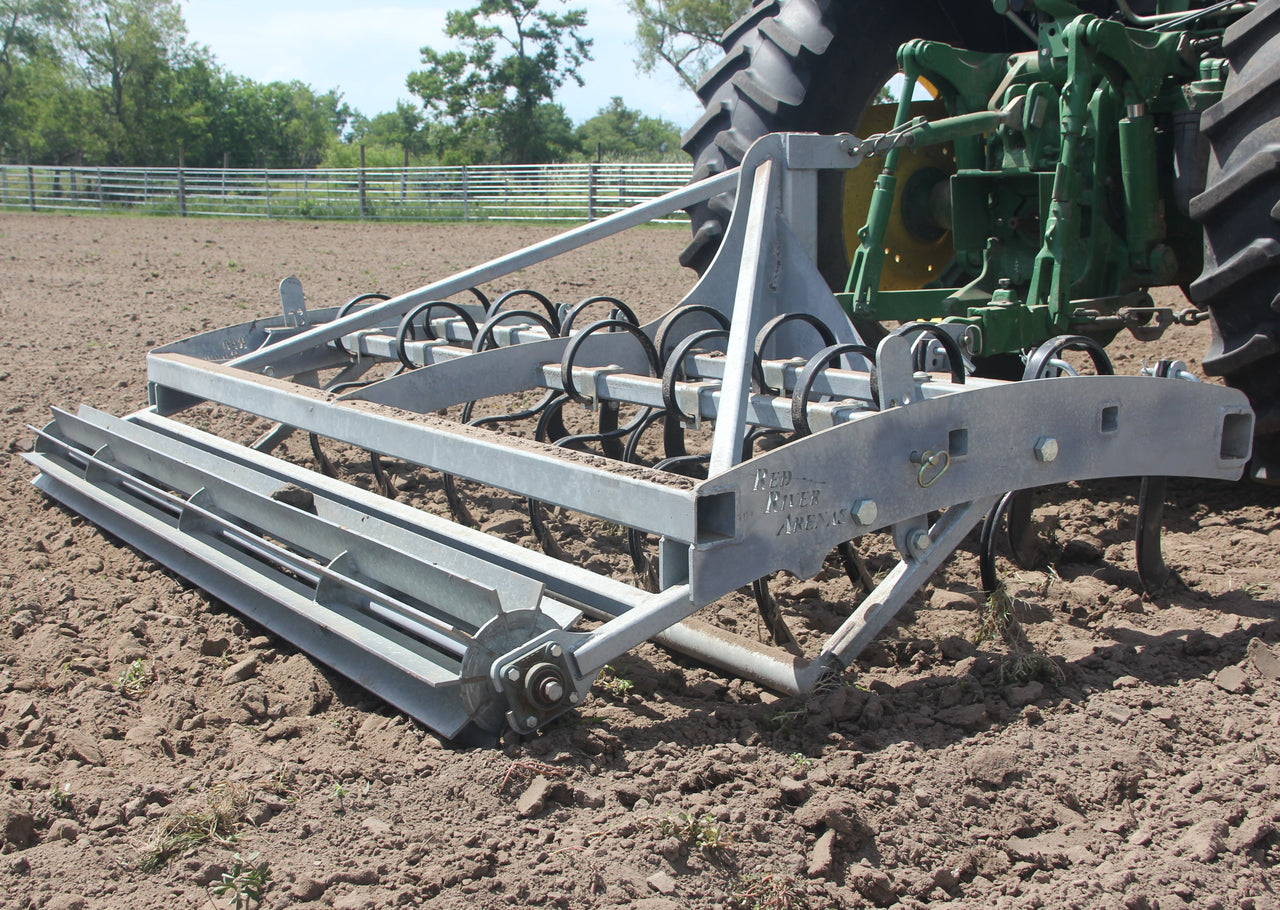 Heavy-duty Buster 2.0 arena groomer and arena drag leveling horse arena footing behind tractor