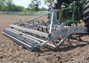 Heavy-duty Buster 2.0 arena groomer and arena drag leveling horse arena footing behind tractor